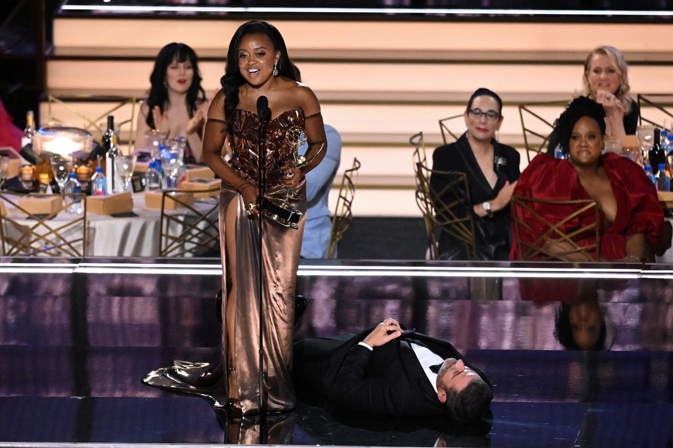 Jimmy Kimmel lies onstage as US writer Quinta Brunson accepts the award for Outstanding Writing For A Comedy Series for “Abbott Elementary” during the 74th Emmy Awards at the Microsoft Theater in Los Angeles, California, on September 12, 2022. Photo: Getty Images Patrick T. Fallon/AFP